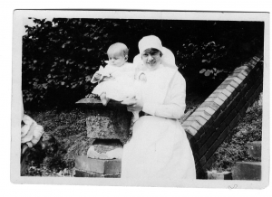 Photo of Elizabeth Flemming with a baby at Warren Road Hospital, 1928.